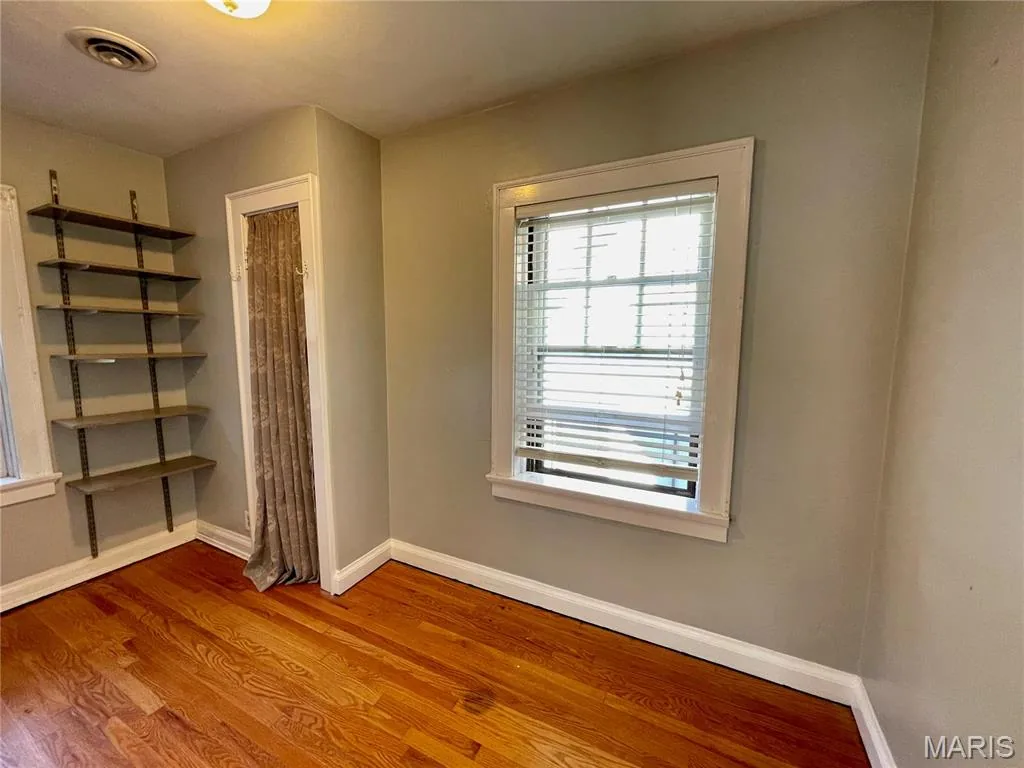 Bedroom with built-in shelving