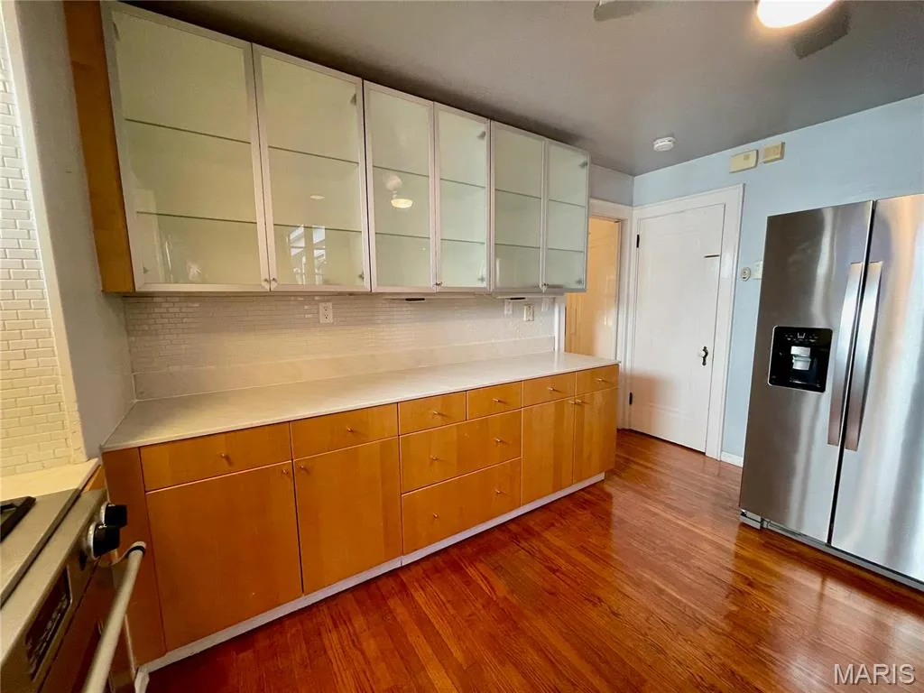 Kitchen with glass-front cabinetry