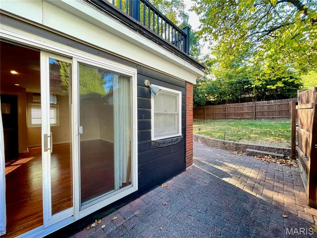 Brick patio at the rear of the home